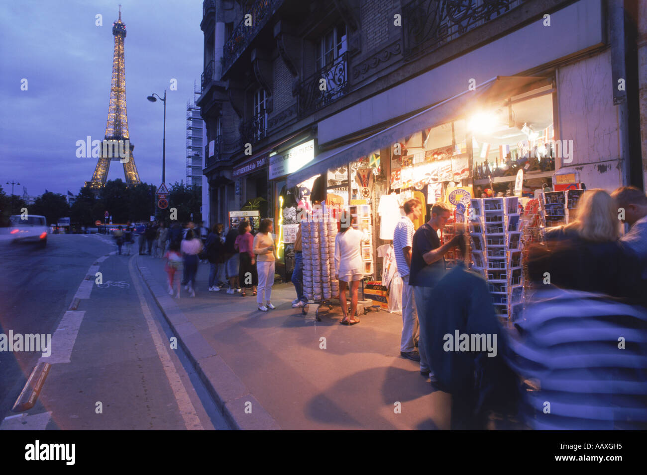 Tourist souvenir shop in Paris at Bir Hakeim at night with Eiffel Tower