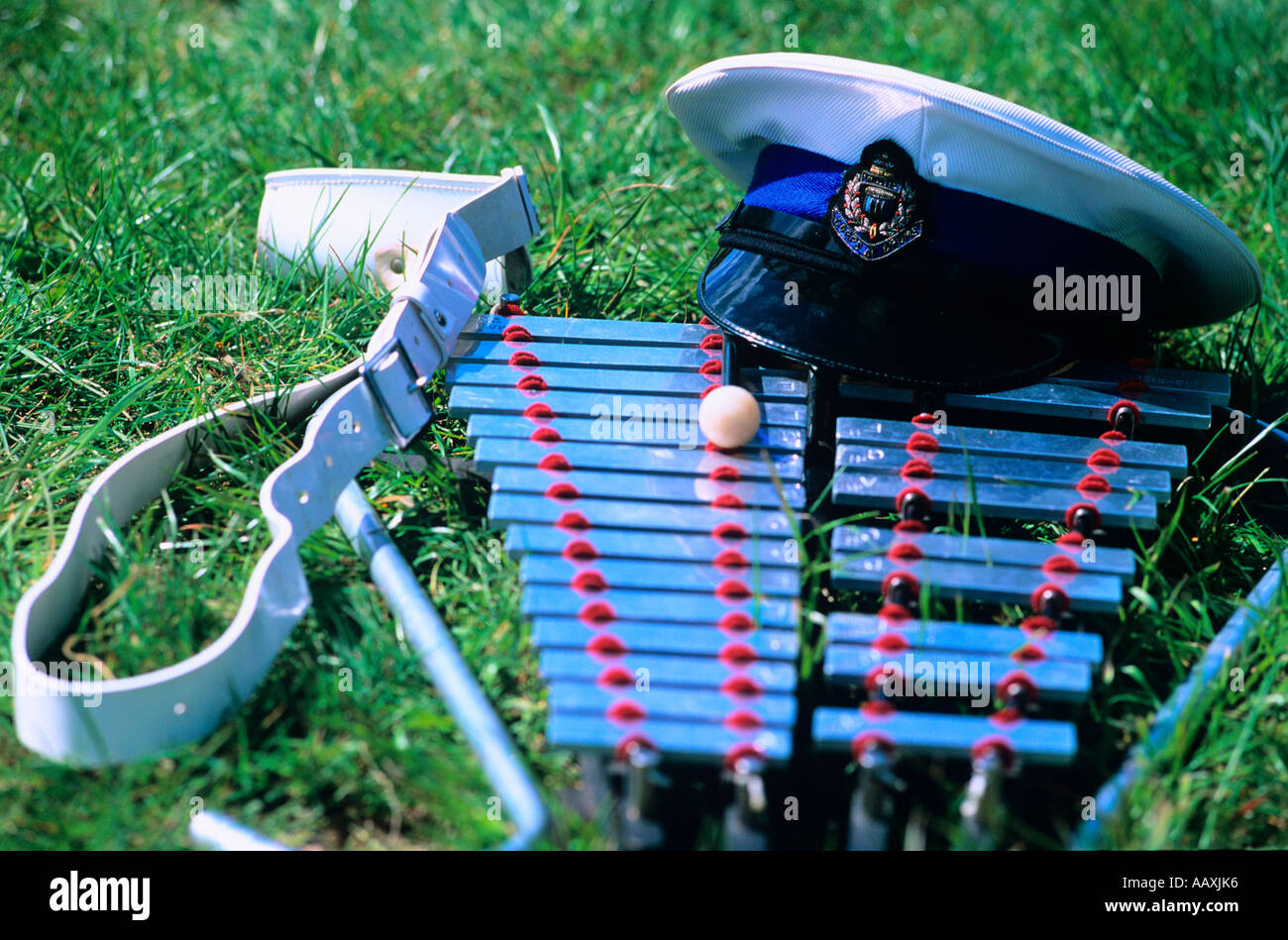 Some musical instruments and a bandsmans uniform lying or laying on the