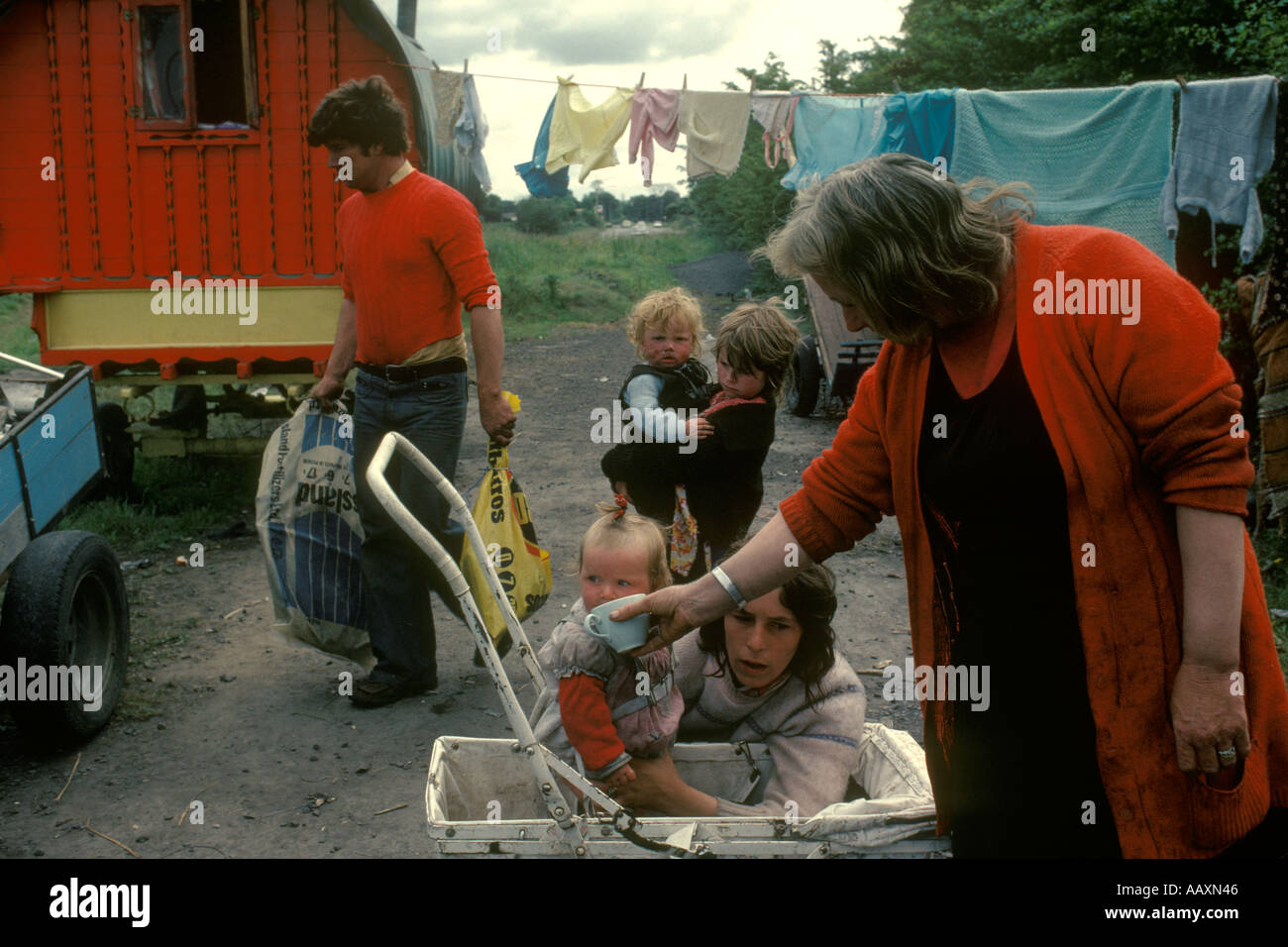 Gypsy camp family West Coast Southern Ireland Eire. Young mother and baby father grandmother, three generations.1970s 70s HOMER SYKES Stock Photo