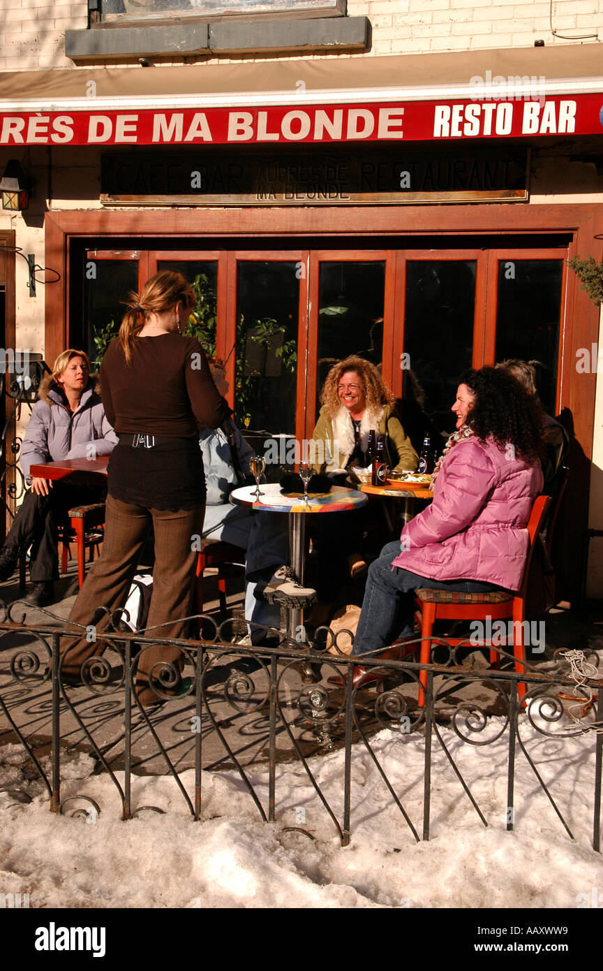 People on a terrace St Denis street in the month of march enjoying a