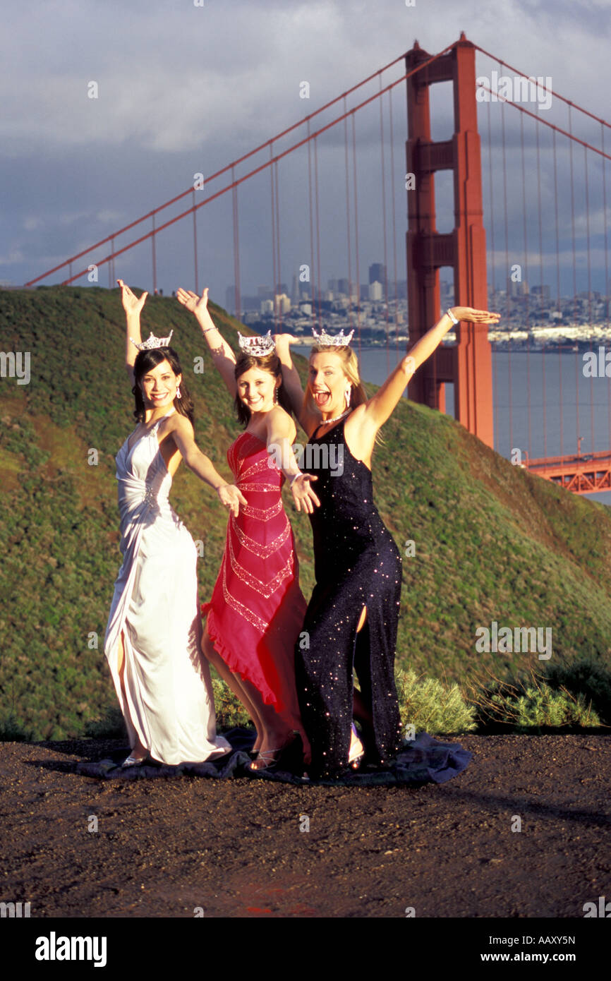 Beauty pagent queens celebrate at the Golden Gate Bridge in San Francisco California vertical Stock Photo