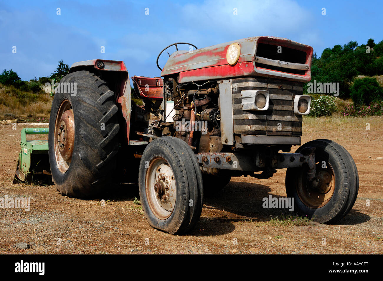 Old rusty wheeled tractor Stock Photo