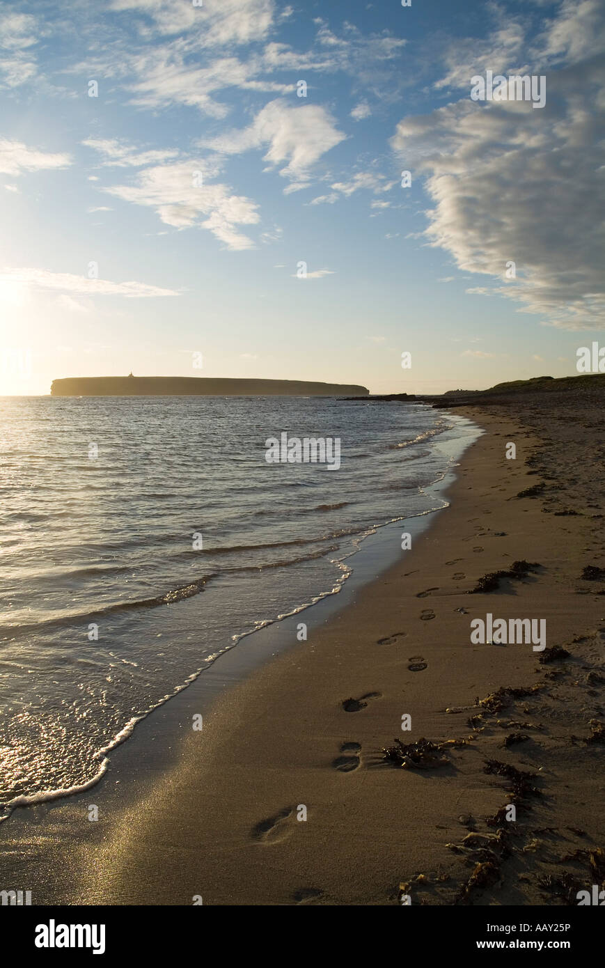 dh Birsay Bay BIRSAY ORKNEY Footprints in the beach sand along sunset seashore Brough of Birsay Stock Photo