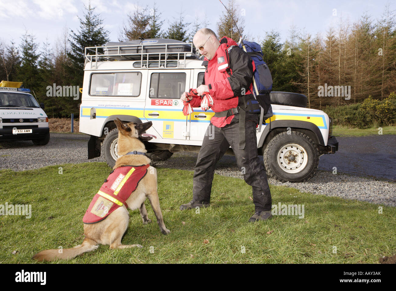 Galloway Mountain Rescue training a young dog with Landrover rescue