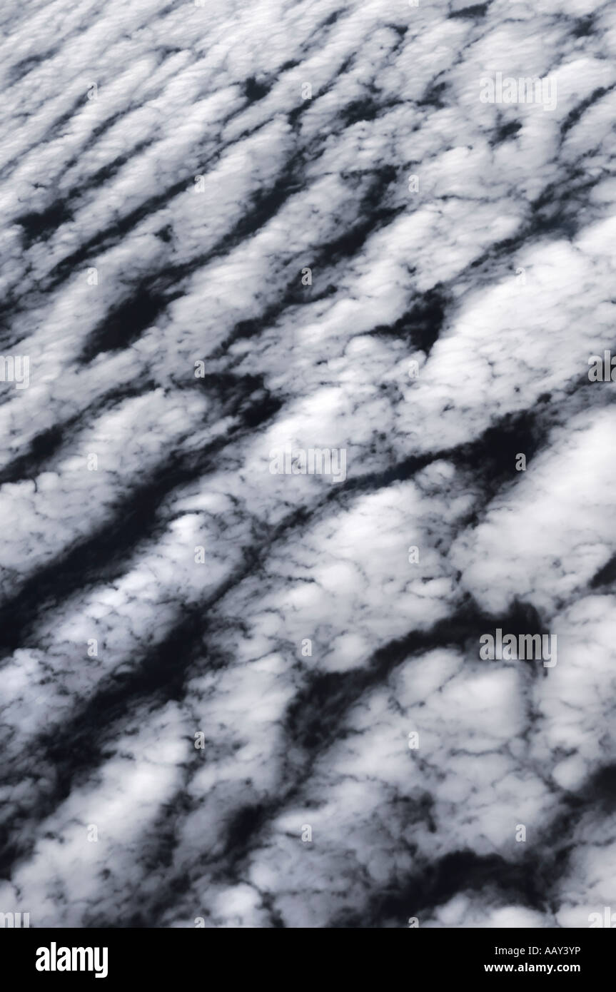 Mid level white clouds Altocumulus undulatus abstract background Stock Photo