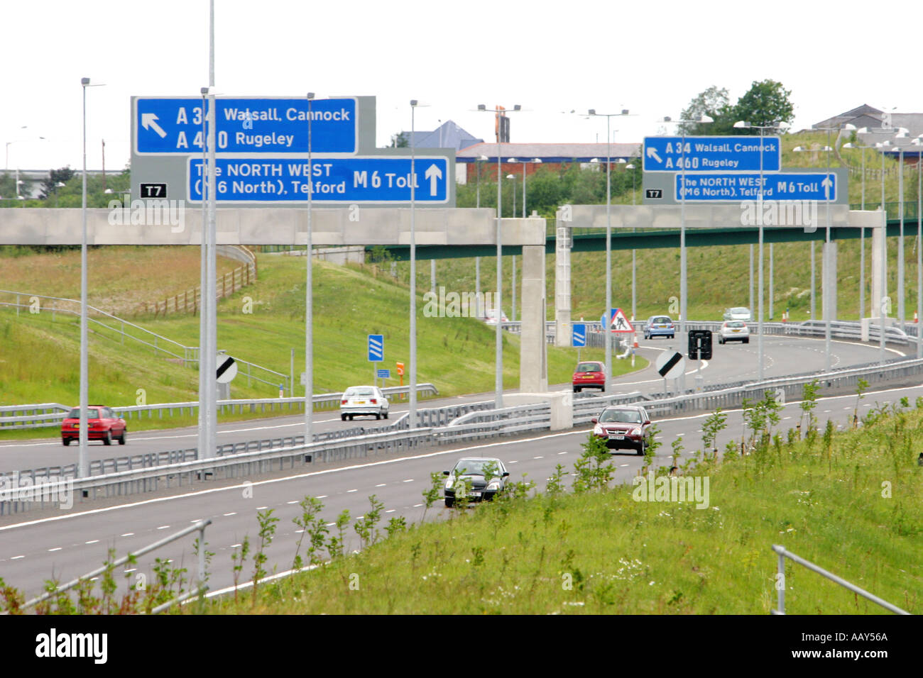 Signs and toll booths on the M6 toll road England Stock Photo