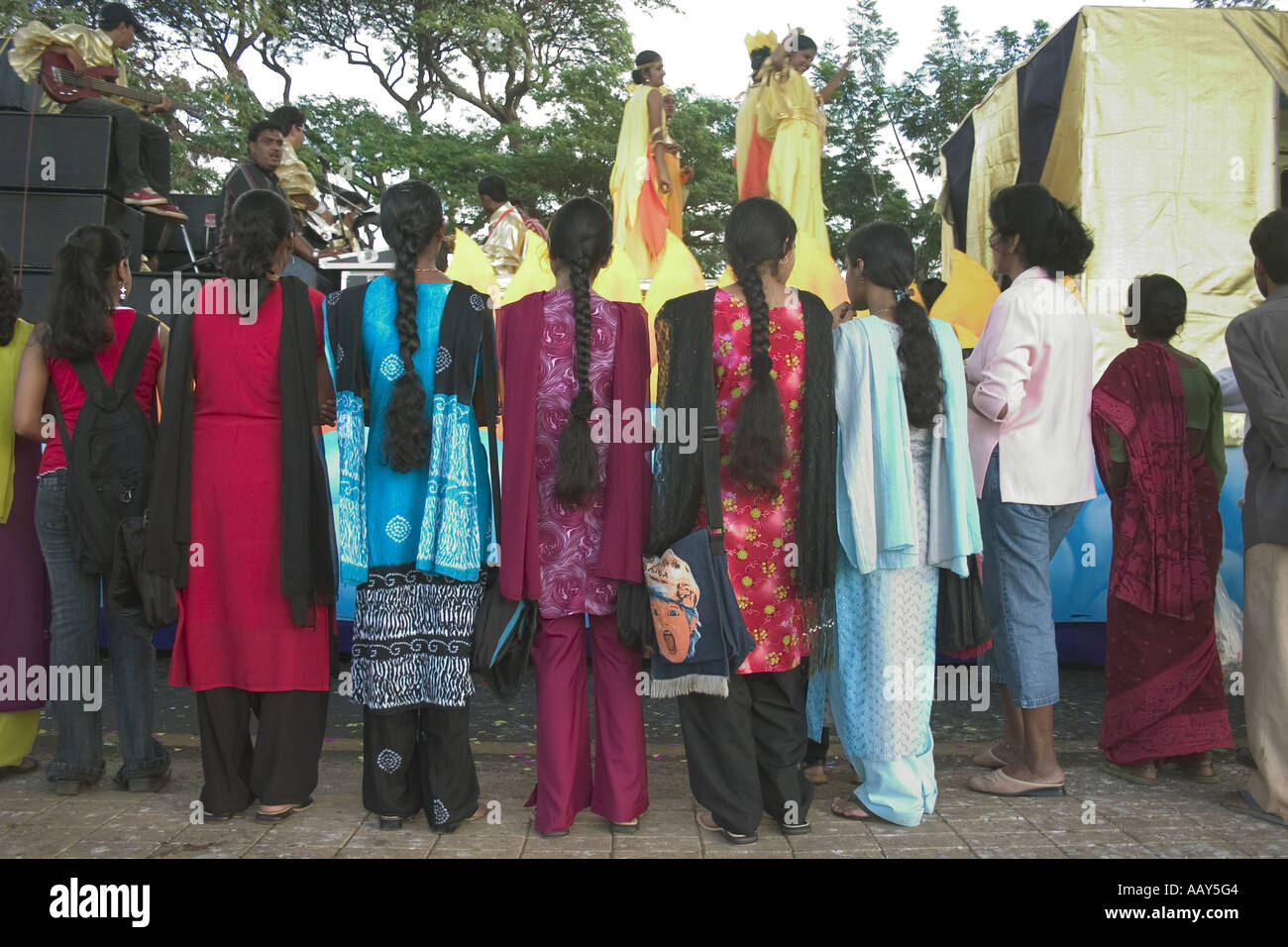 RSC78646 Girls with long black hair wearing Punjabi suit watching dancers  Stock Photo - Alamy