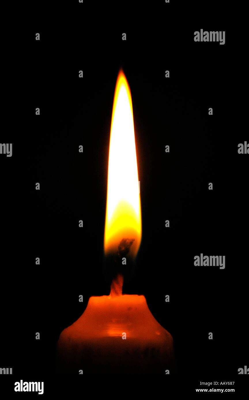 Candle burning in the dark Stock Photo Alamy