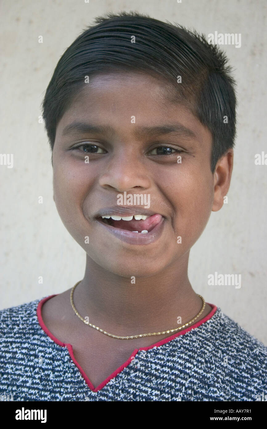 RSC78685 Indian boy tongue innocence Bombay Mumbai Maharashtra India Model released 542 Stock Photo