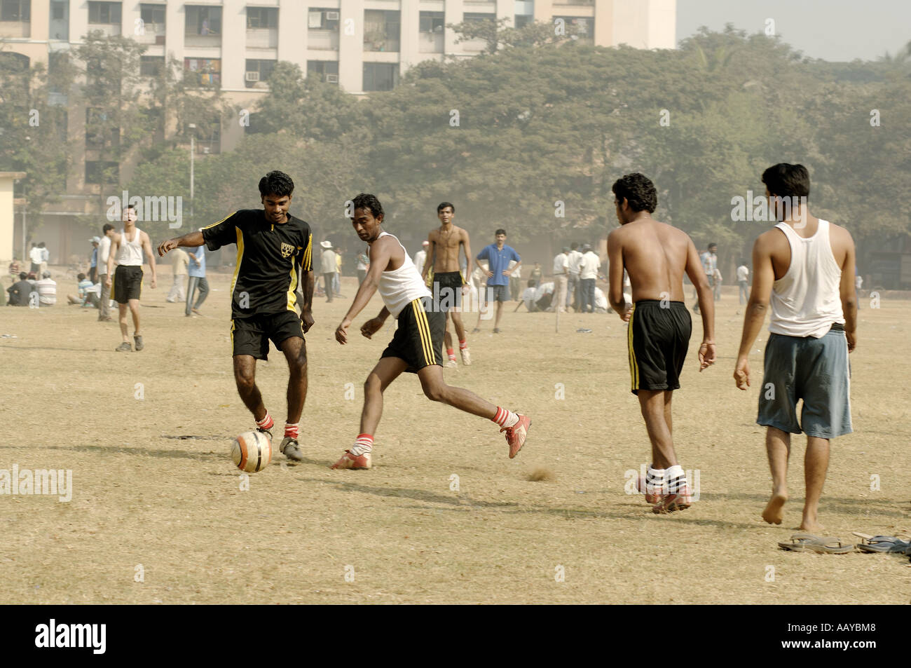 HMA78753 Indian boys playing football on playground Bombay Mumbai ...