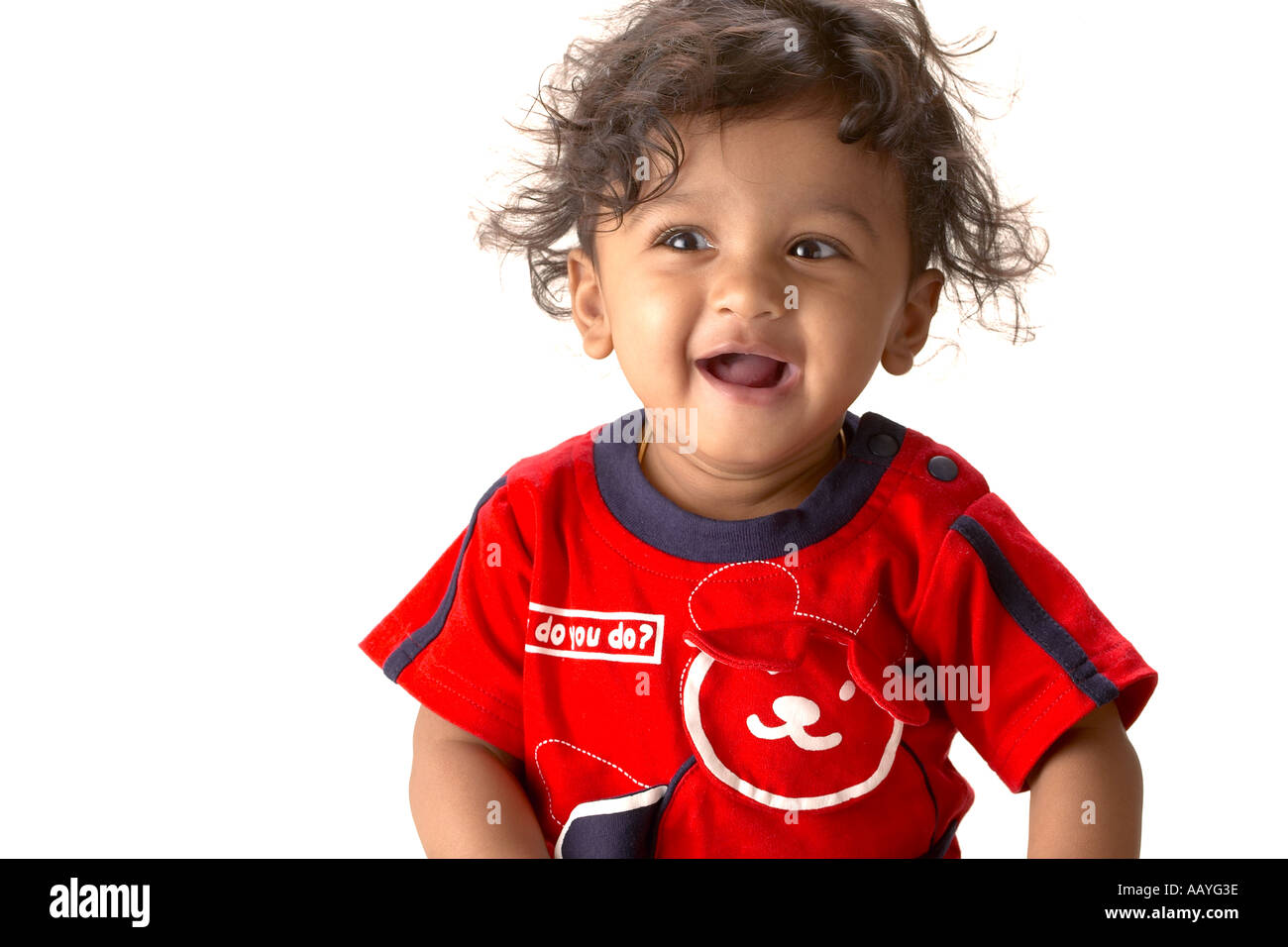 Asian Indian ten months boy wearing red T shirt looking towards camera on white background Stock Photo