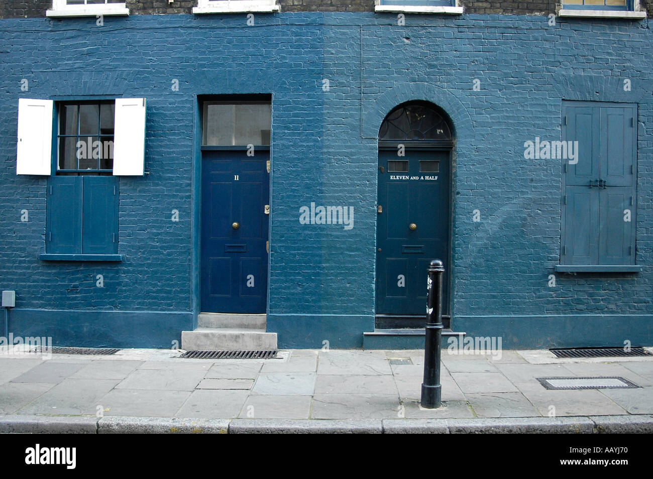 Houses on Fournier Street, Spitalfields numbered 11 and Eleven and a Half (now blue paint removed from number 11) Stock Photo