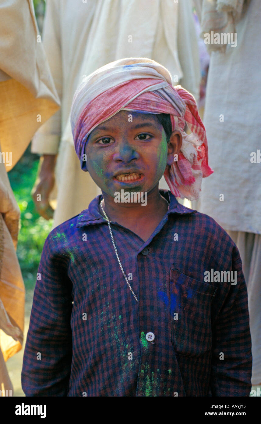 Young boy celebrates Holi Festival at the Benegenaati Sattra on the river island of Majuli, Assam. Stock Photo