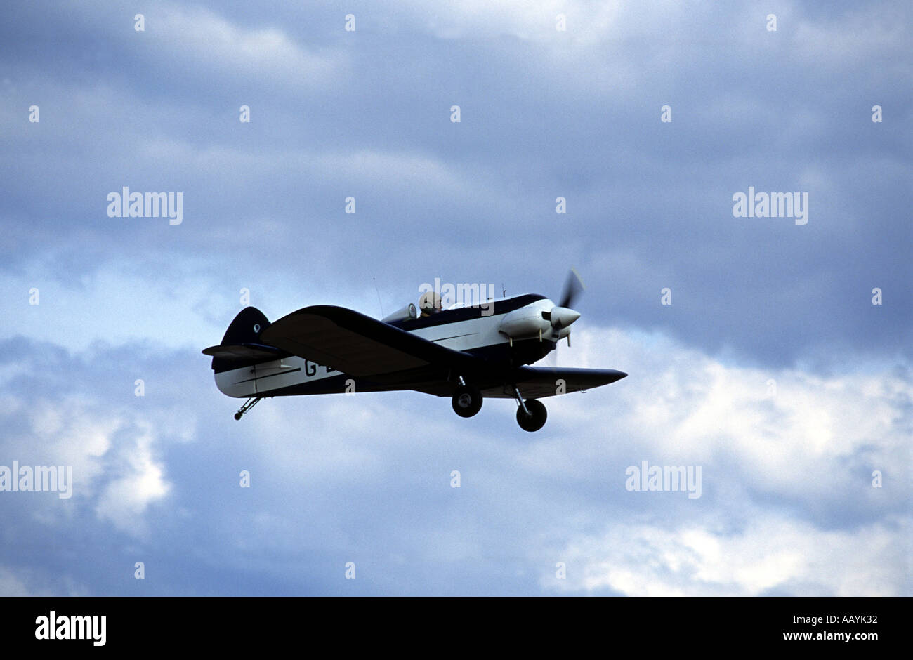 A single seat light aircraft taking off from a private airfield, Boxsted, Essex, UK. Stock Photo