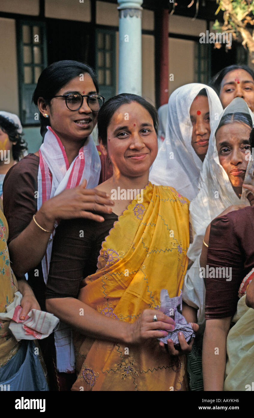 Woman celebrate Holi Festival at the Benegenaati Sattra on the river island of Majuli, Assam. Stock Photo