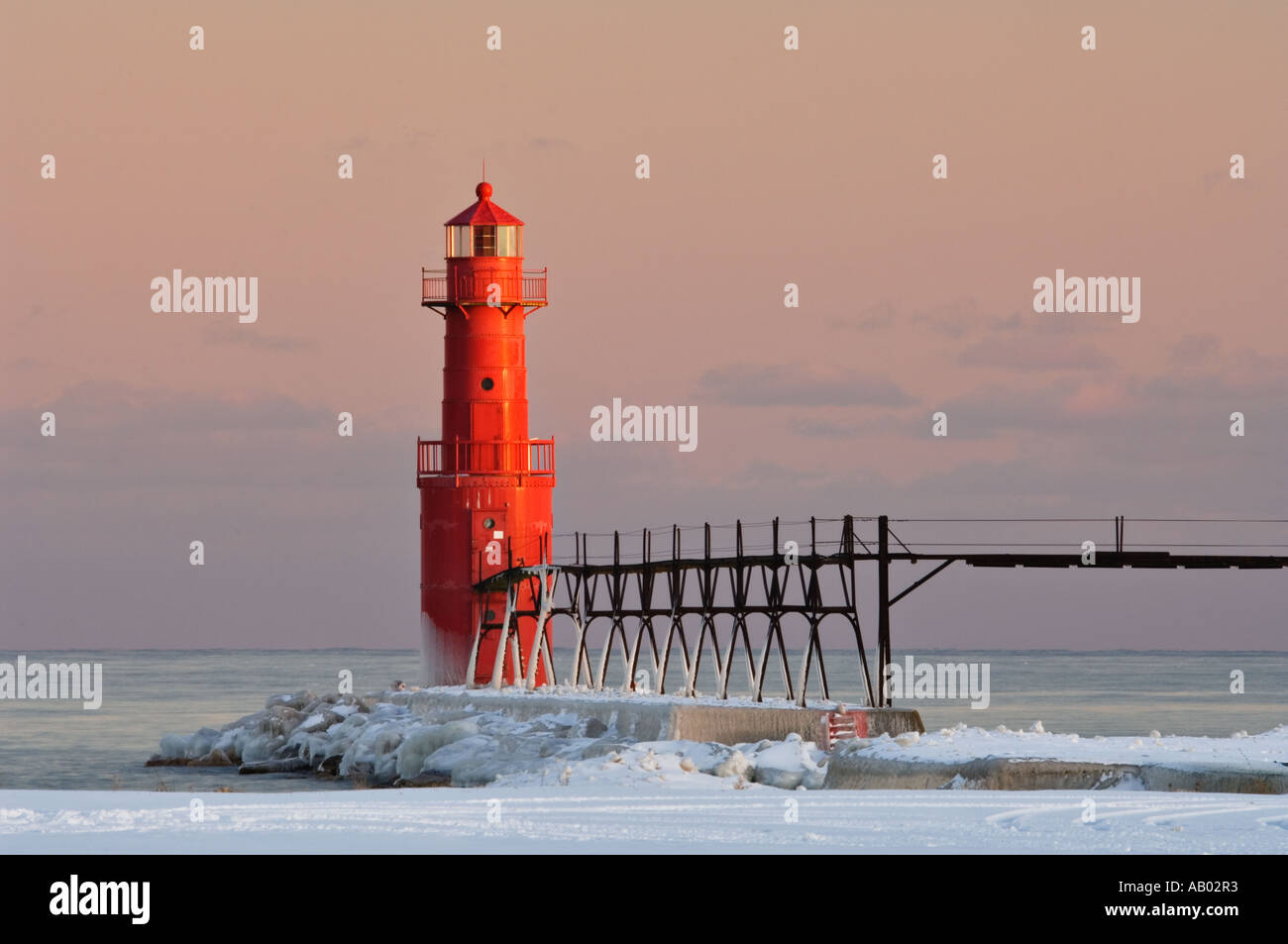 Algoma Pierhead Lighthouse and Snow at Sunset Algoma Wisconsin Stock Photo