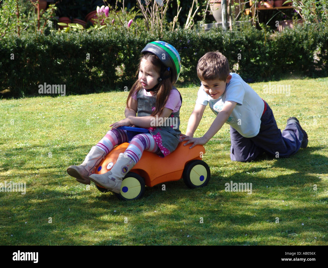Two children playing in the garden in Almere, Holland Stock Photo