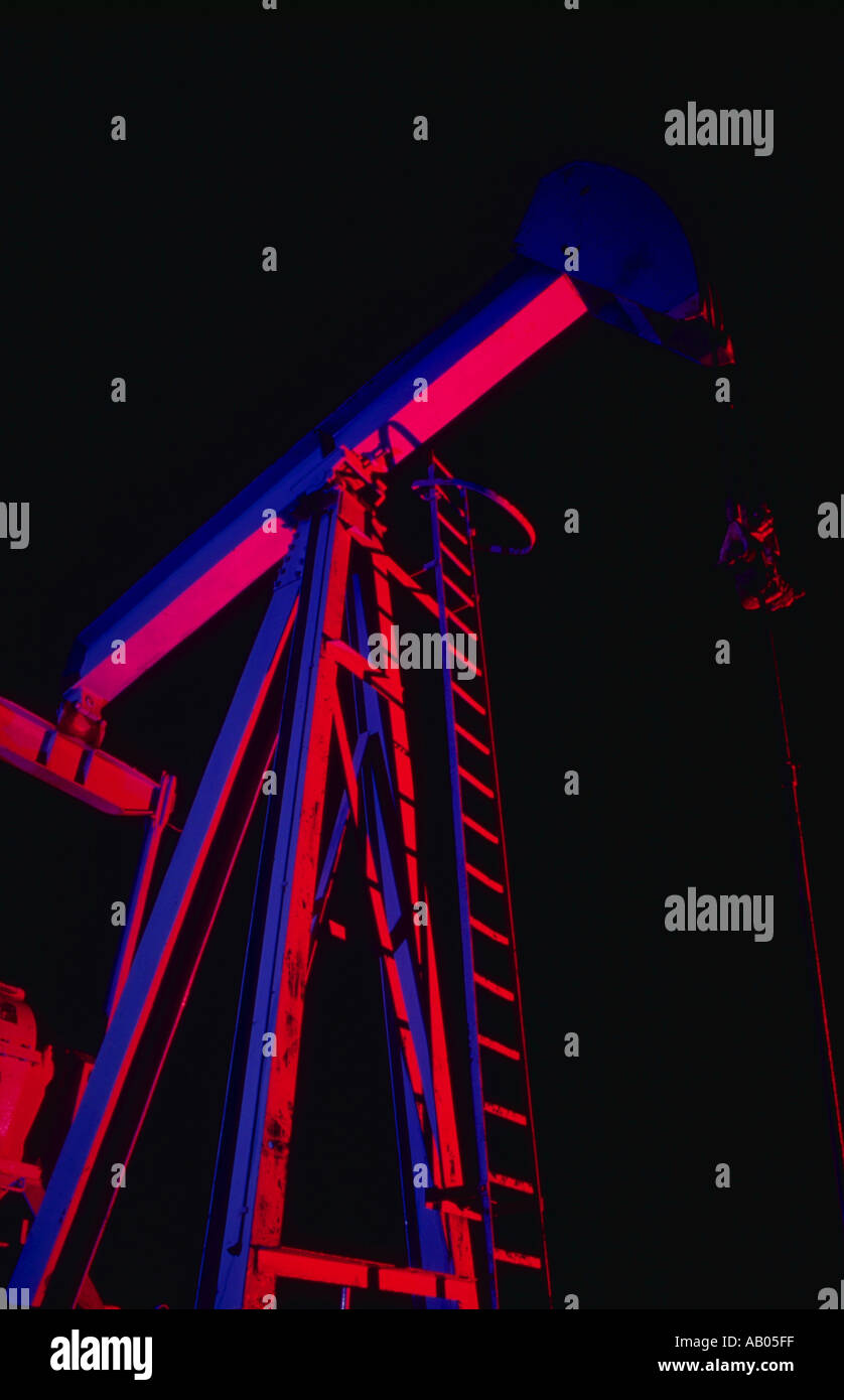 View looking up at a pumpjack oil pump near Midland Texas at night