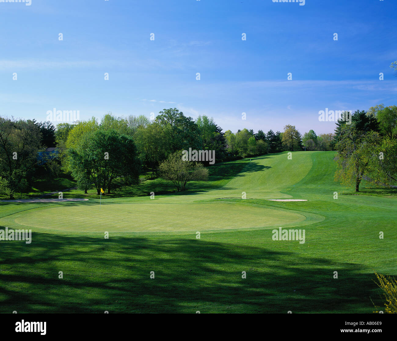 A putting green is at the end of a gently sloping fairway Stock Photo ...