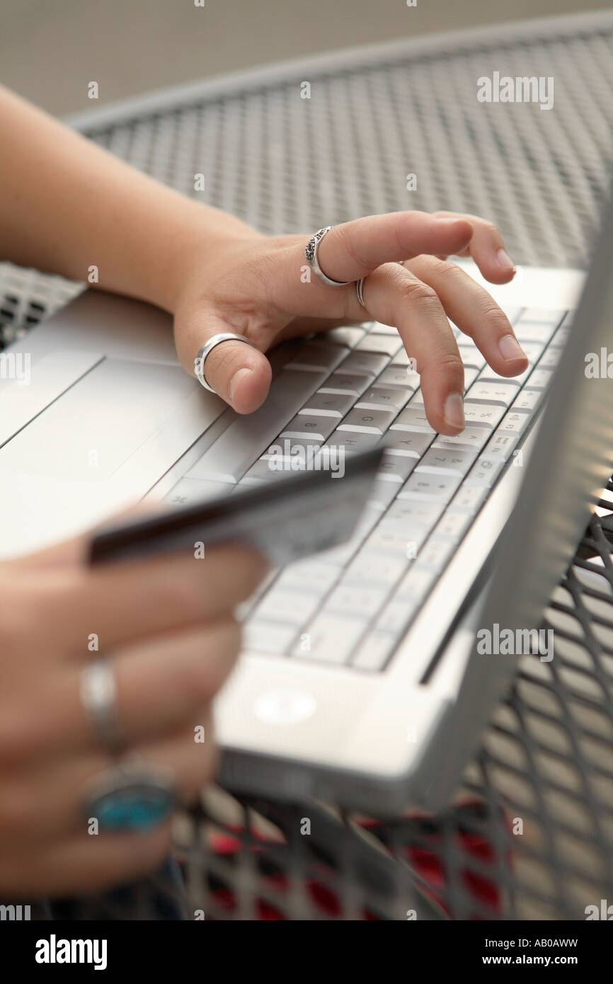 Online shopping at internet cafe Stock Photo