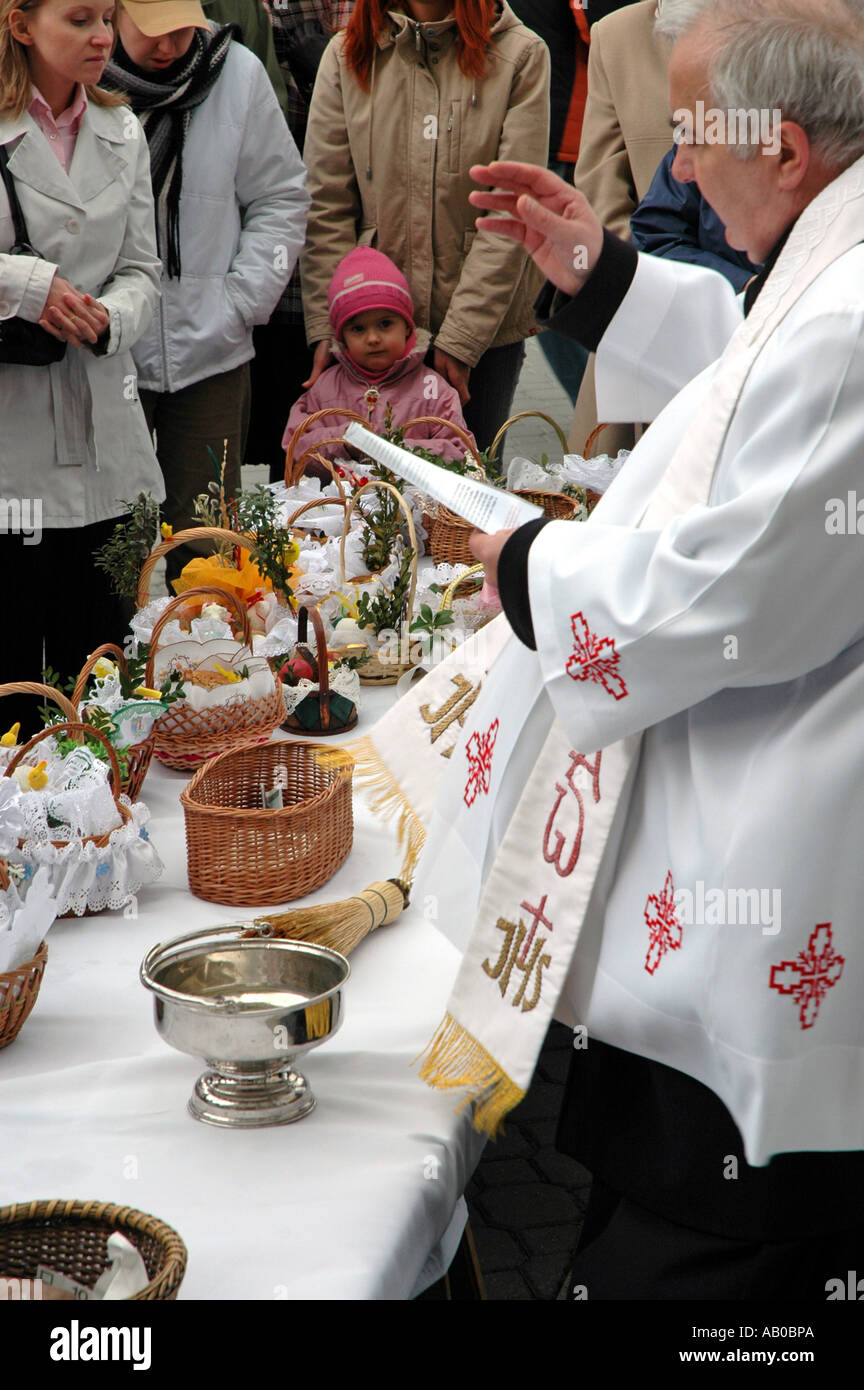 Polish priest blessing Easter baskets with food Stock Photo Alamy
