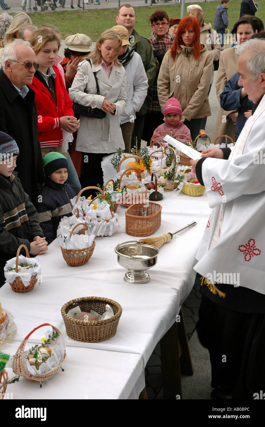 Polish priest blessing Easter baskets with food Stock Photo Alamy