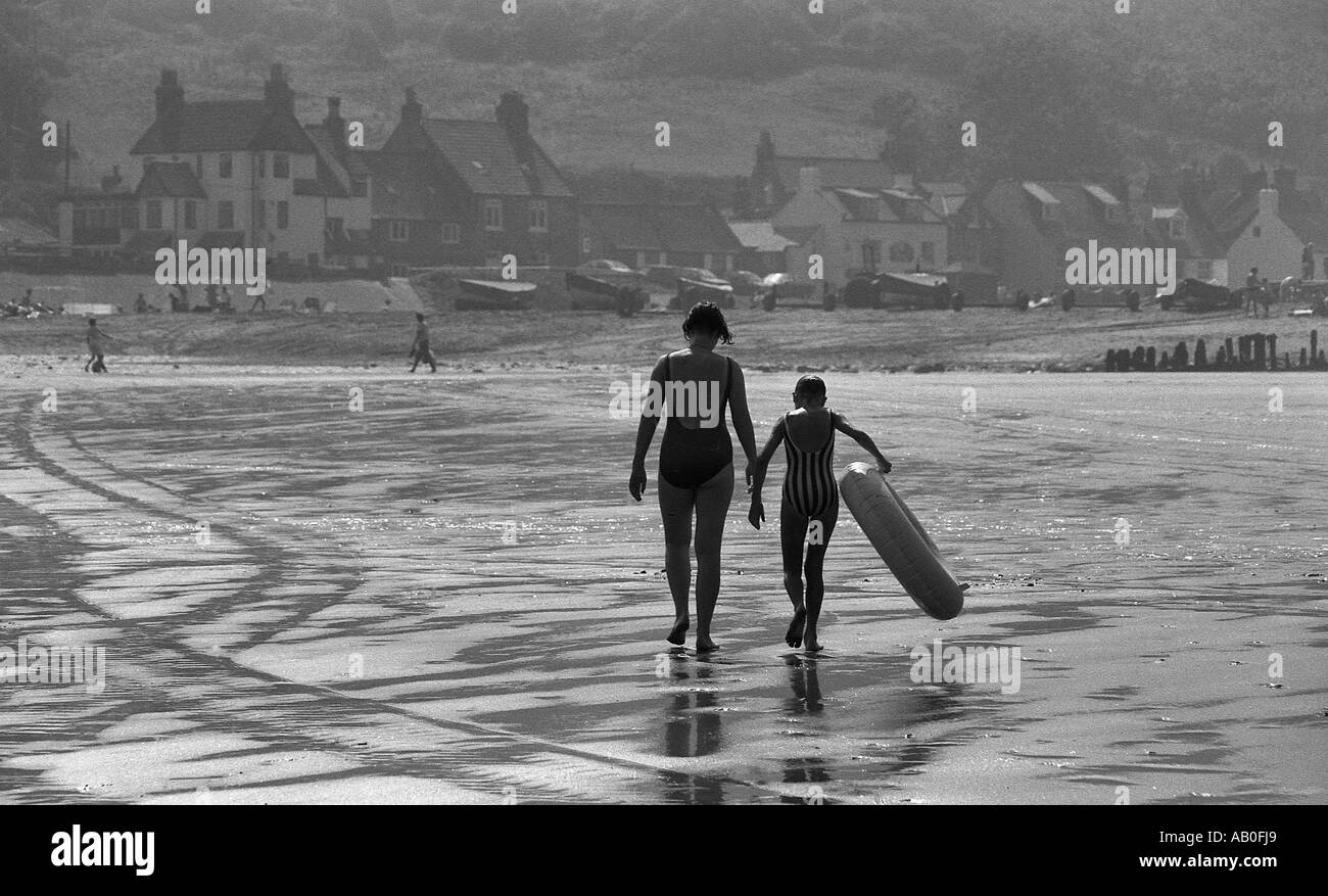 Two girls walking rear view Black and White Stock Photos & Images - Alamy