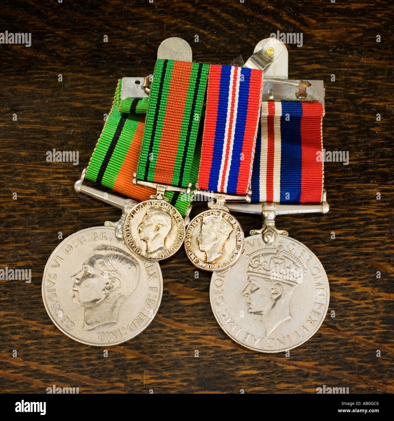 WW2 British Service Campaign war medals with smaller versions for wearing on a lapel Stock Photo