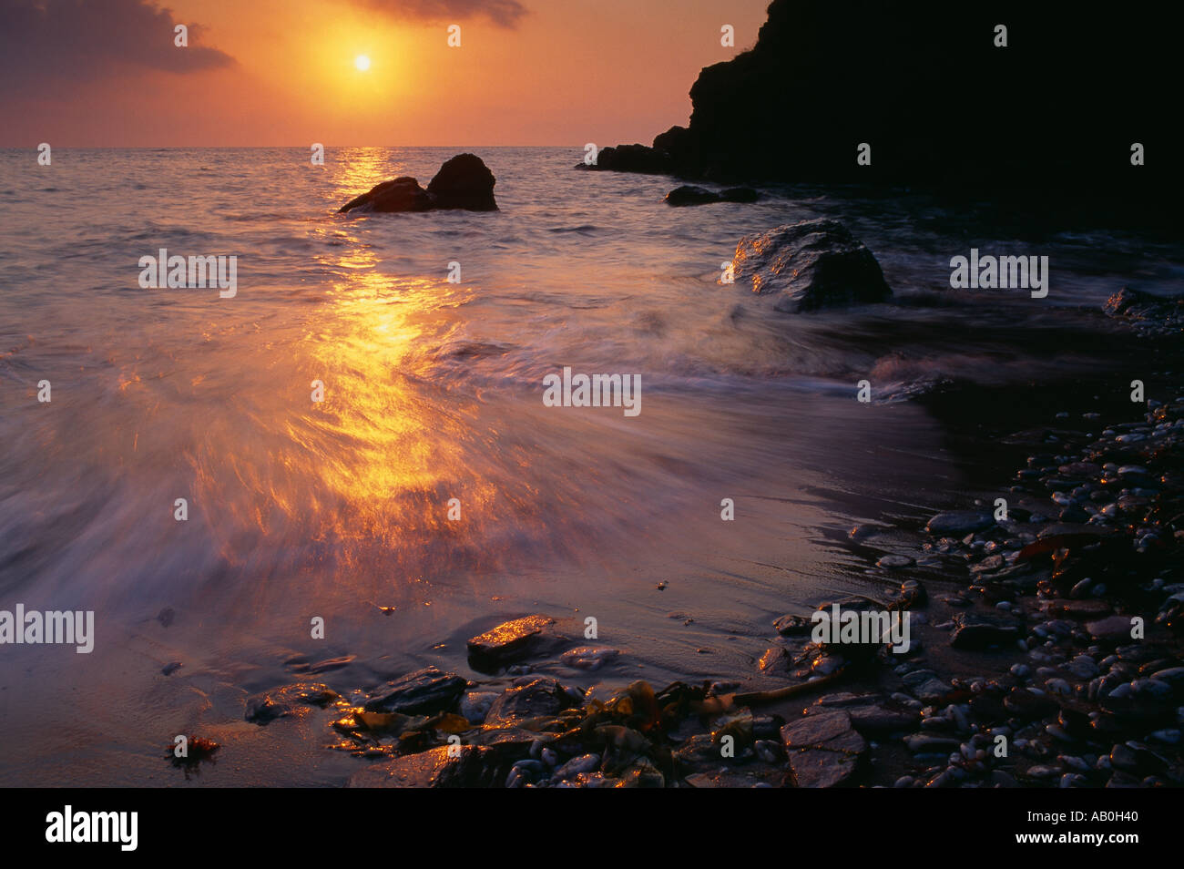 sunrise on the beach at Scabbacombe nr Kingswear South Devon England UK Stock Photo