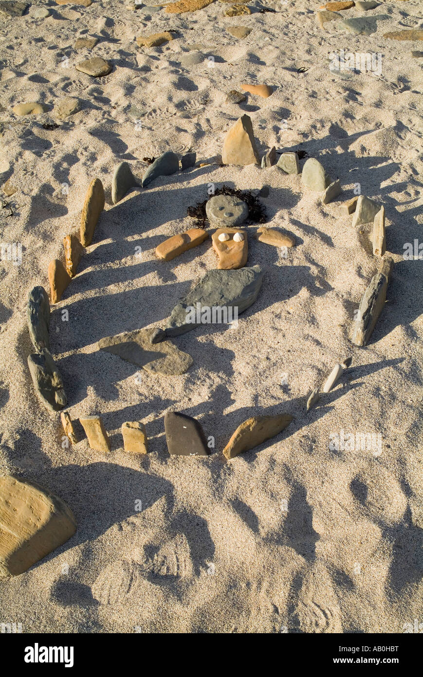 dh  BIRSAY ORKNEY Childrens beach art ring of stones mermaid doll Stock Photo