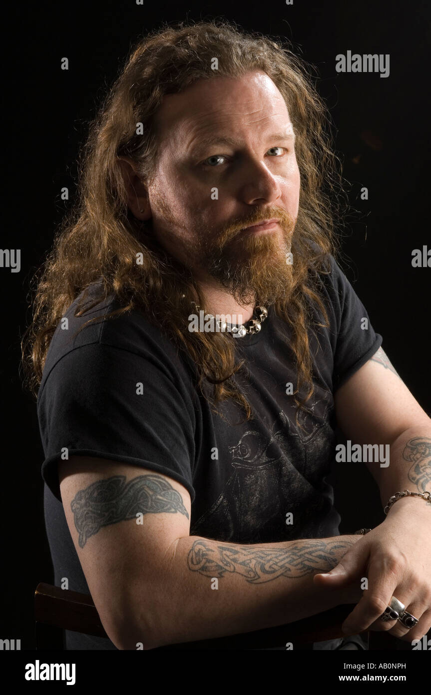 A rocker with long beards and long hair participates in the festival  redheads Stock Photo - Alamy