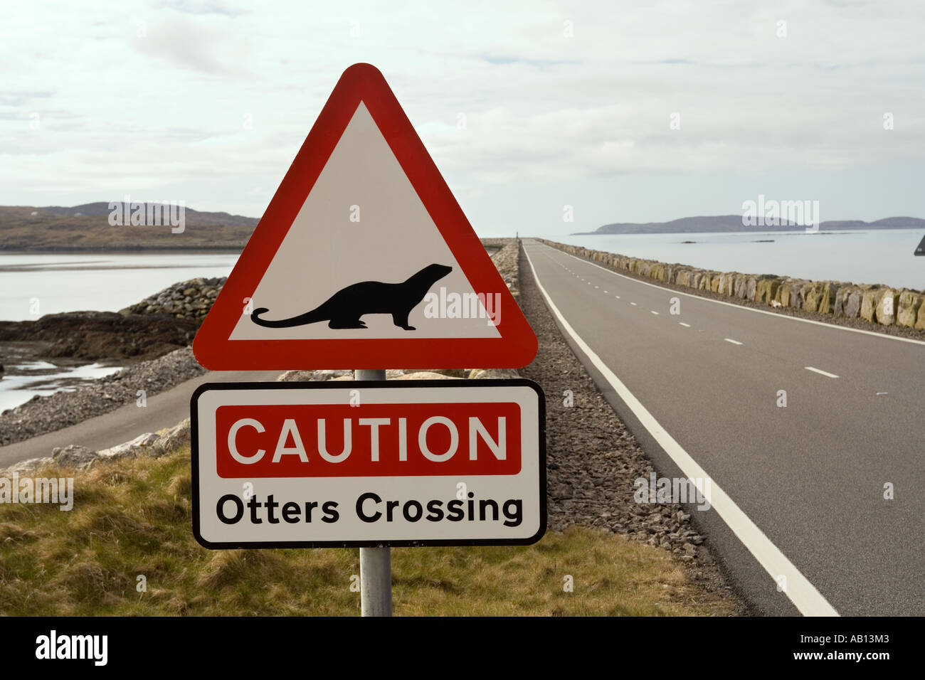 UK Scotland Western Isles Outer Hebrides Eriskay causeway beware otters crossing warning sign Stock Photo