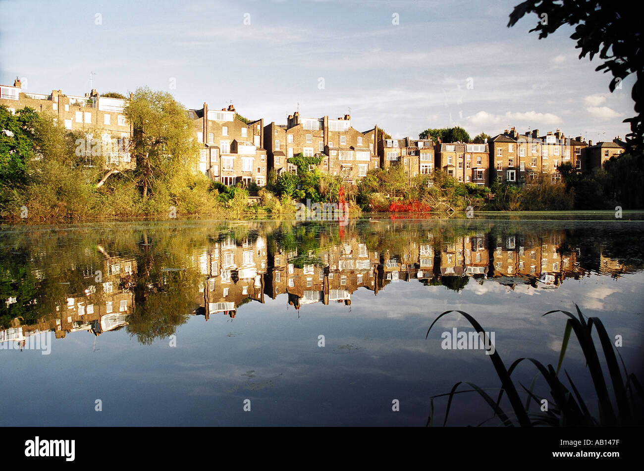 day South Hill Park houses overlooking pond on Hampstead Heath London