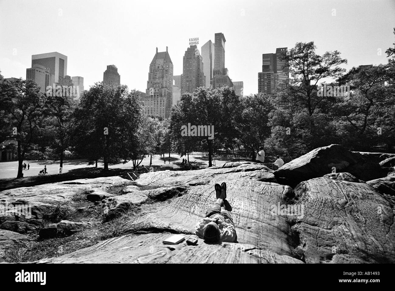 A visitor to Central Park in New York takes a nap Stock Photo