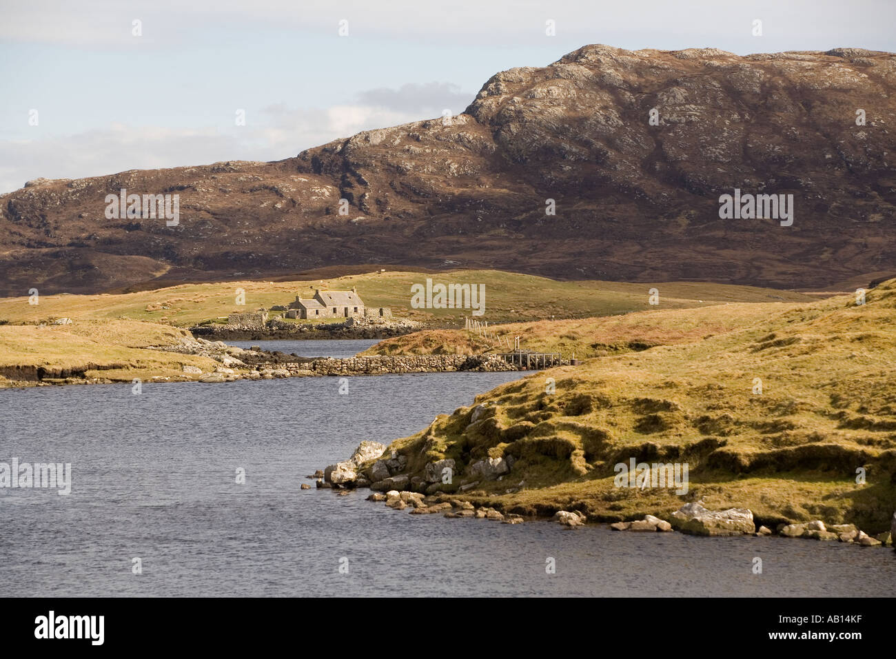 UK Scotland Western Isles Outer Hebrides North Uist Lochmaddy croft beside sea loch Stock Photo