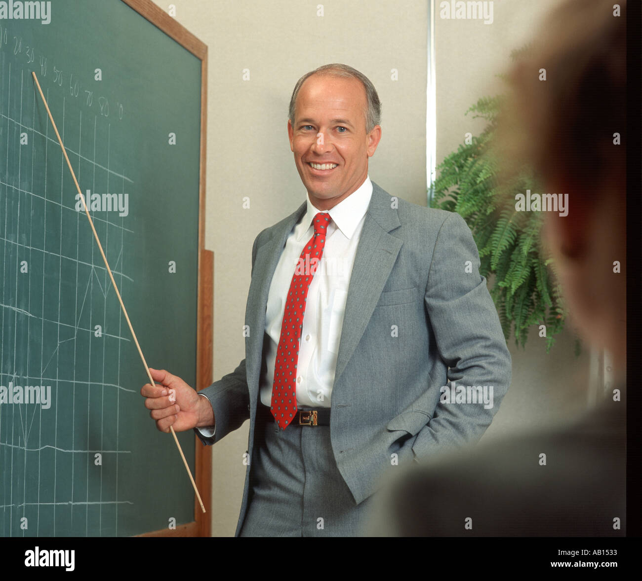financial planner teaching about money management Stock Photo