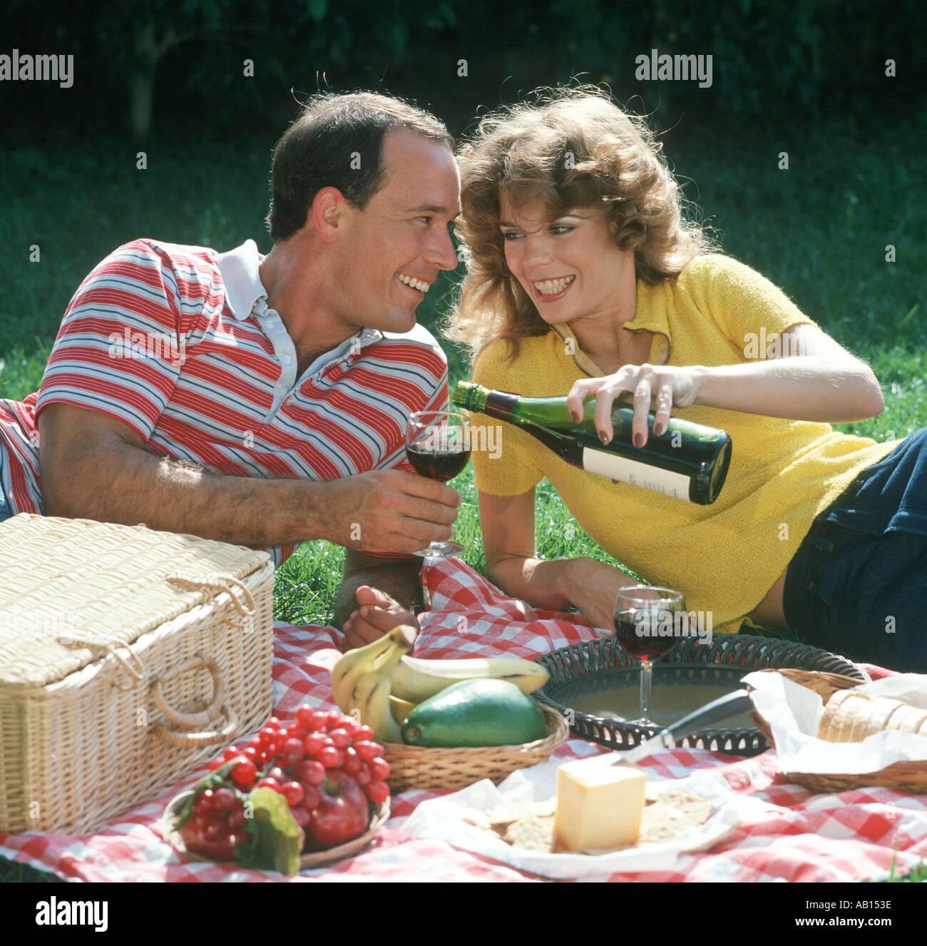 couple enjoying a picnic lunch in a romantic site Stock Photo