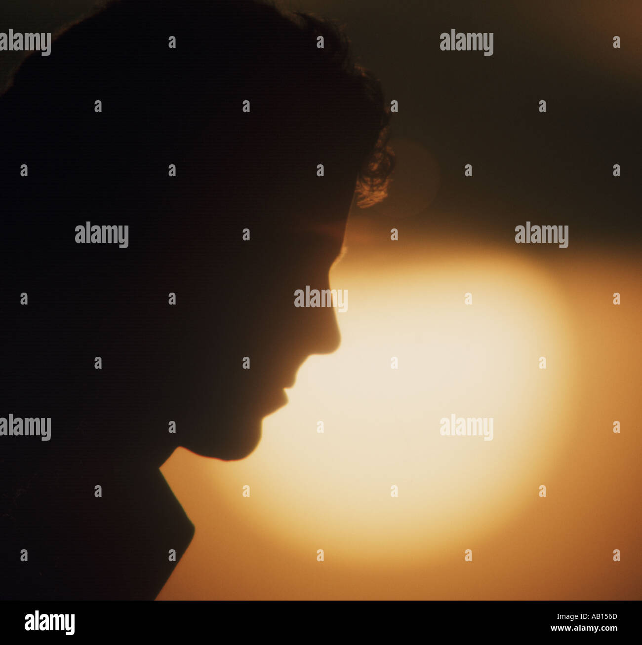 young man in pensive mood at sunset Stock Photo