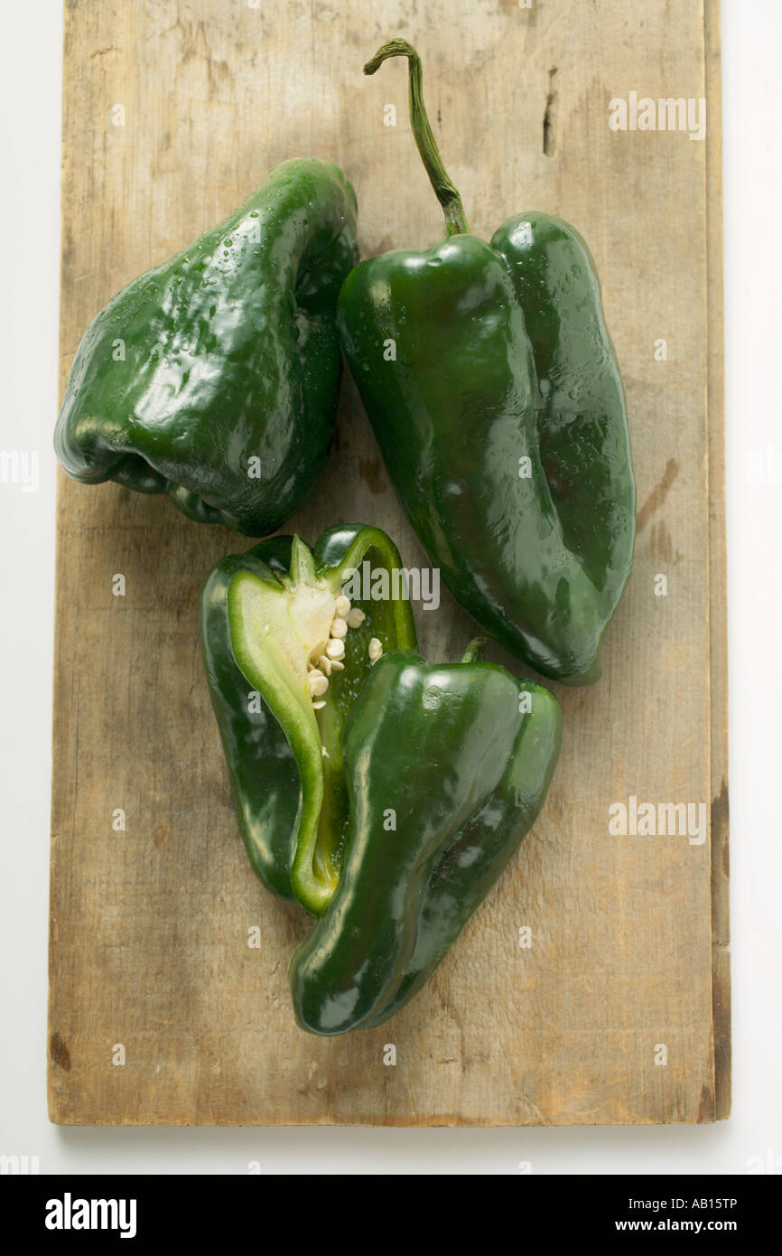 Green peppers Poblano from Mexico on chopping board FoodCollection Stock Photo