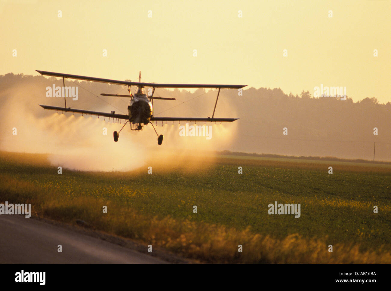 Crop duster flying over Skagit Valley near Mount Vernon Washington Stock Photo