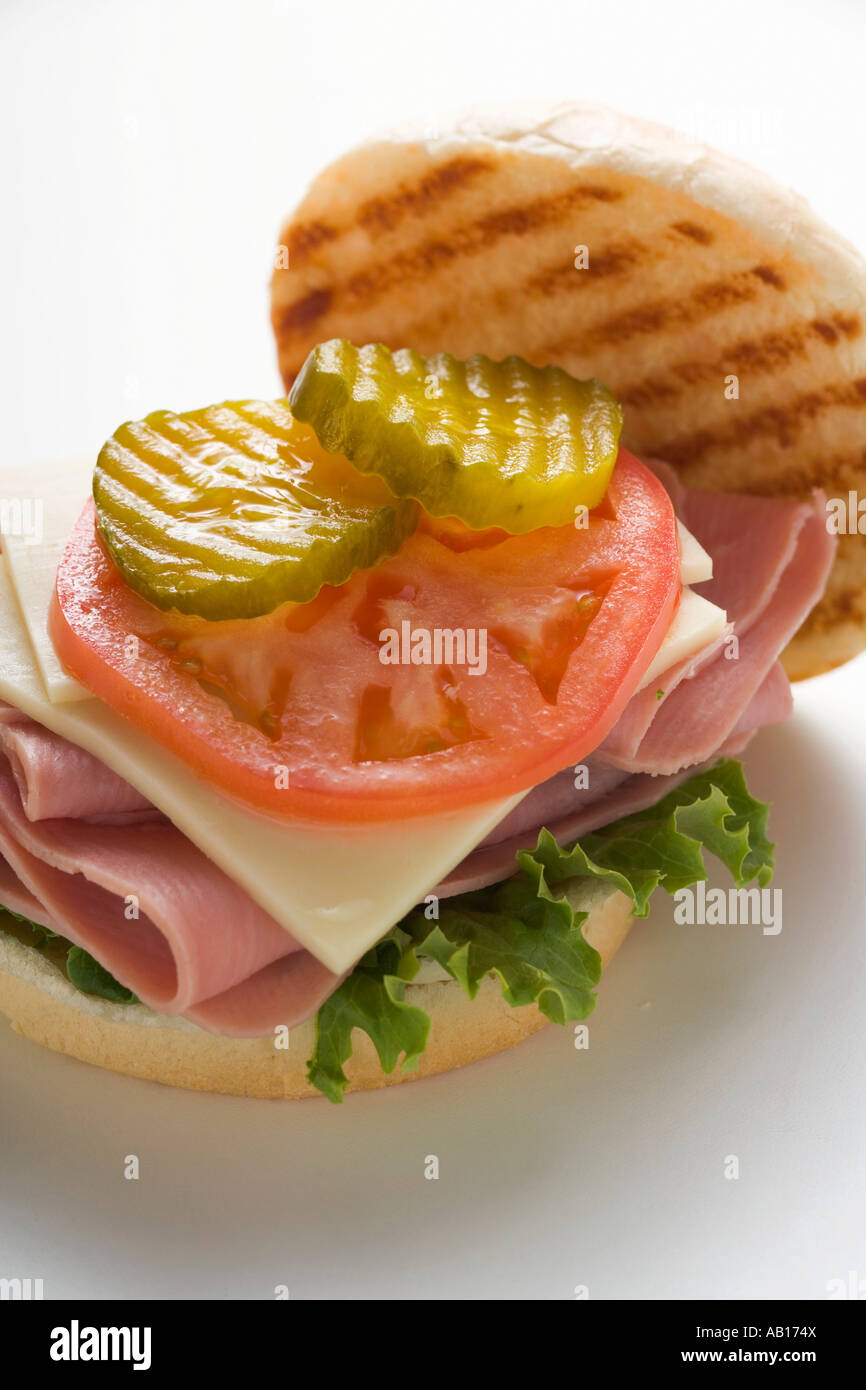 Ham cheese tomato and gherkin in kaiser roll FoodCollection Stock Photo
