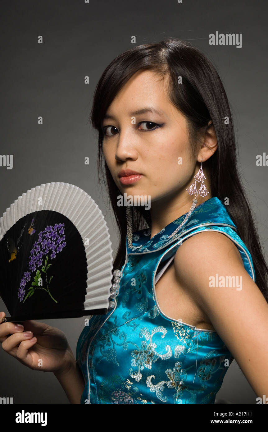 Asian beauty, posing with Chinese Fan Stock Photo