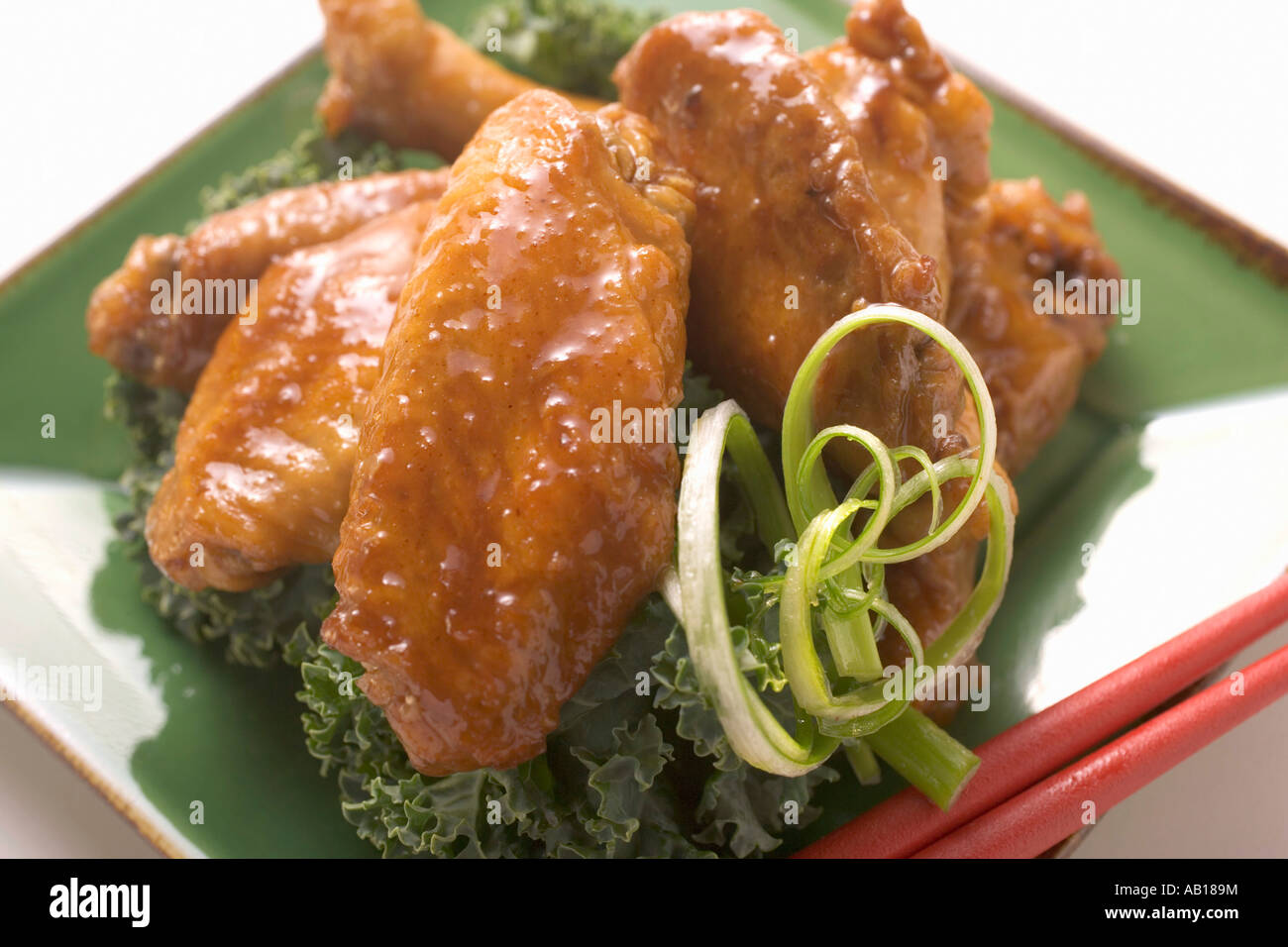 Chicken wings on green plate FoodCollection Stock Photo - Alamy
