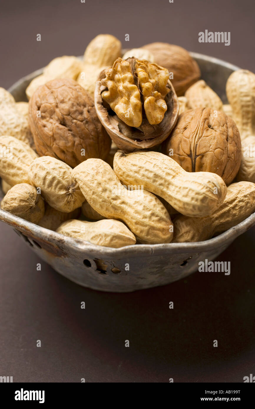 Several peanuts and walnuts in their shells FoodCollection Stock Photo