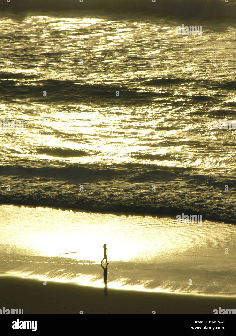 One woman walking beach hi-res stock photography and images - Alamy