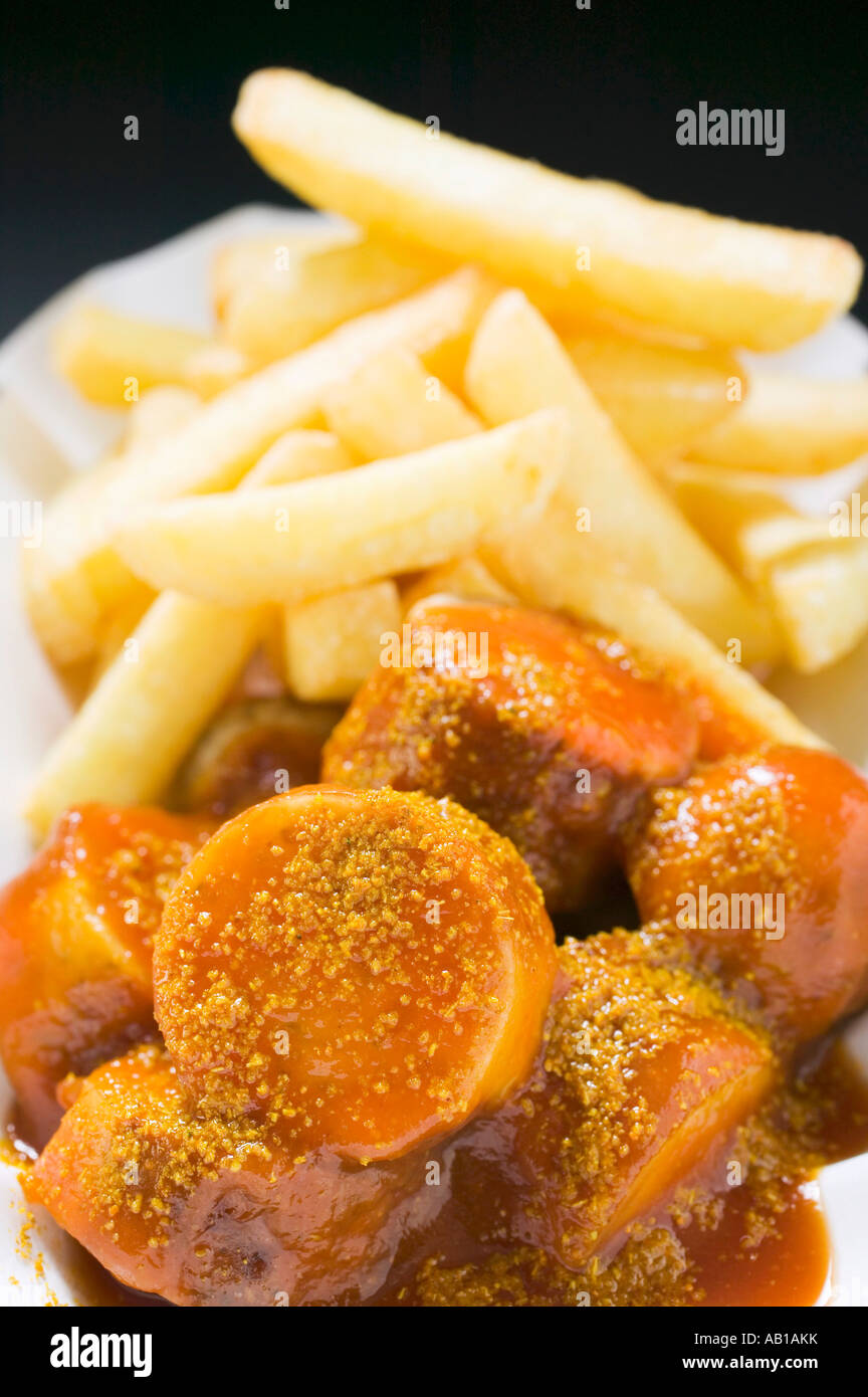 Currywurst sausage with ketchup curry powder and chips FoodCollection