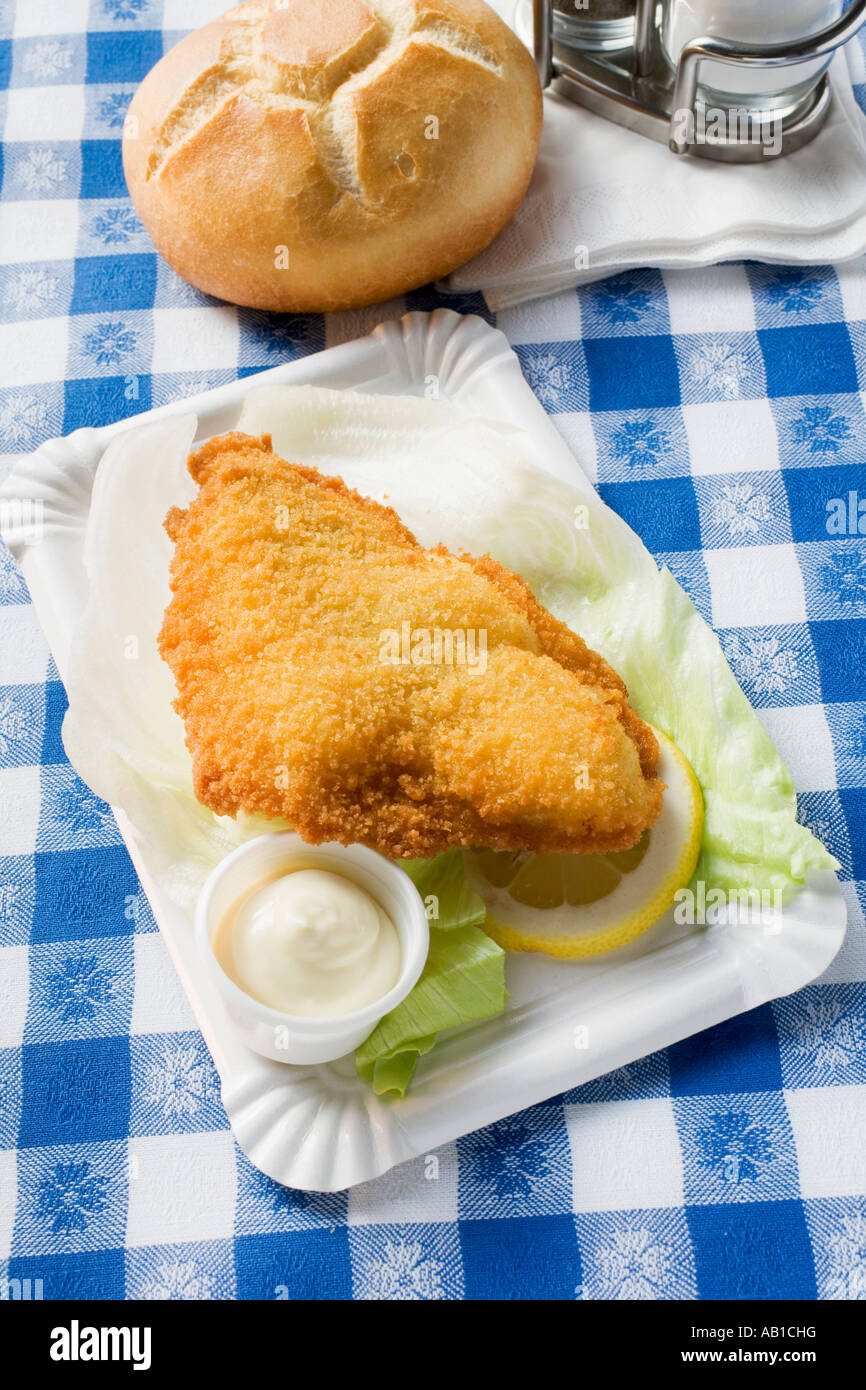 Fish fillet with mayonnaise and bread roll in snack bar FoodCollection