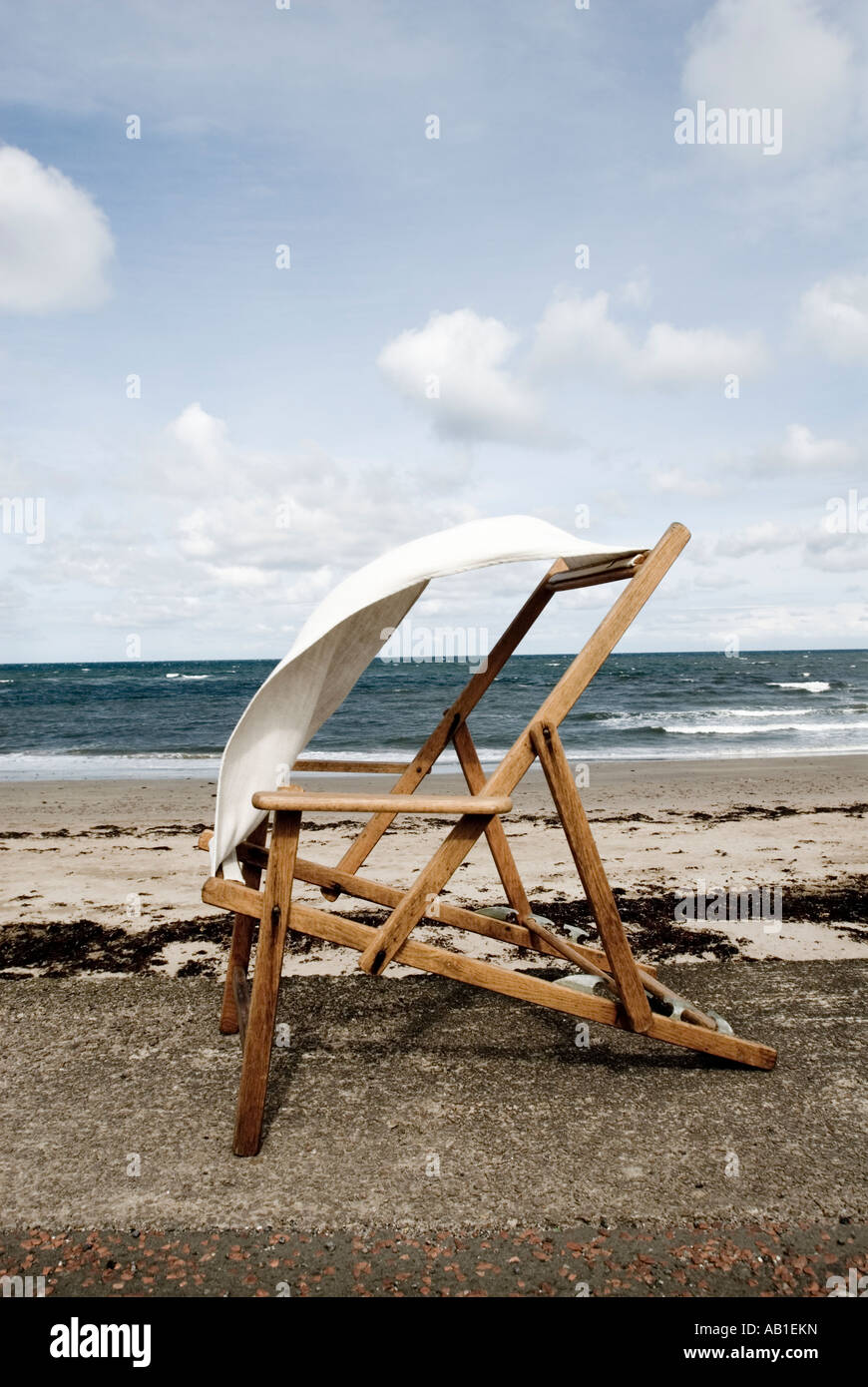 deck chair at seaside on windy day Stock Photo - Alamy