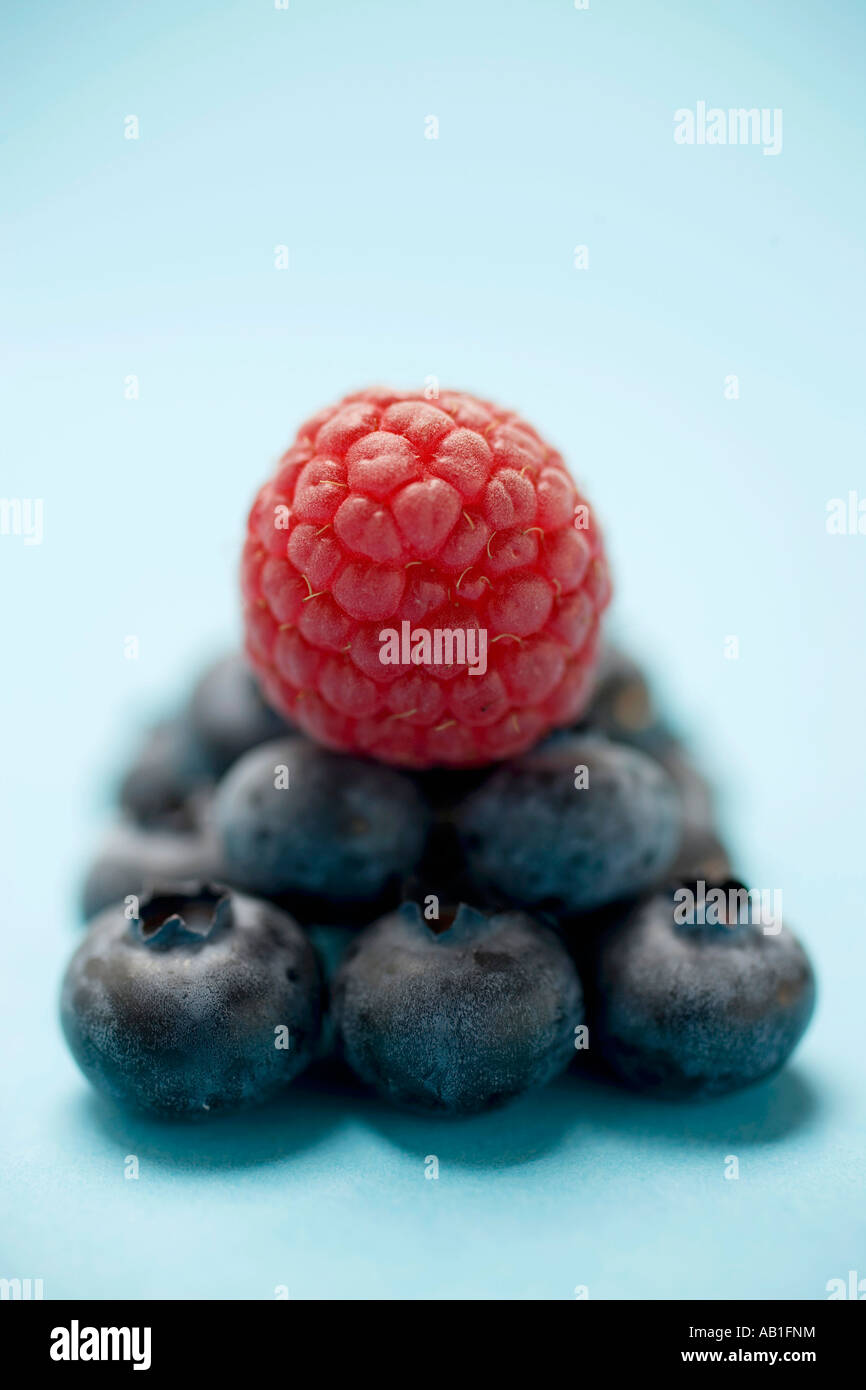 Blueberries and raspberry on blue underground FoodCollection Stock ...