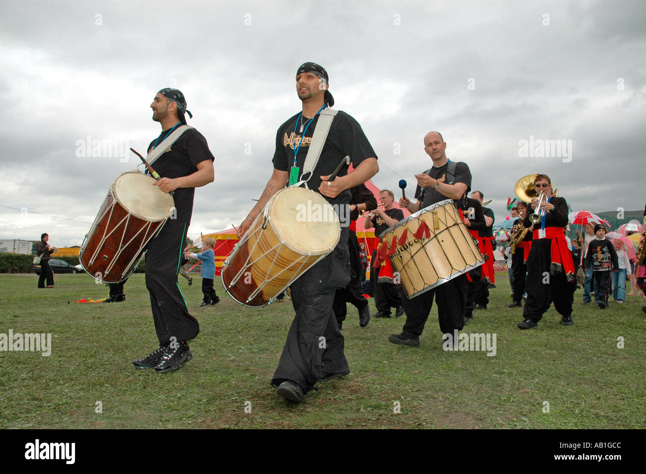 The Bollywood Brass Band leading a parade at the Wychwood Music